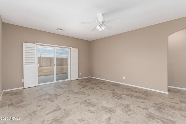 unfurnished room with ceiling fan