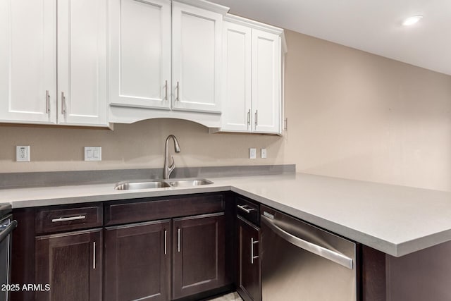 kitchen with dishwasher, dark brown cabinets, sink, and white cabinets