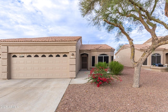 mediterranean / spanish-style home featuring a garage