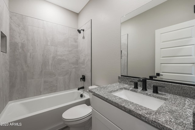 bathroom featuring  shower combination, vanity, and toilet