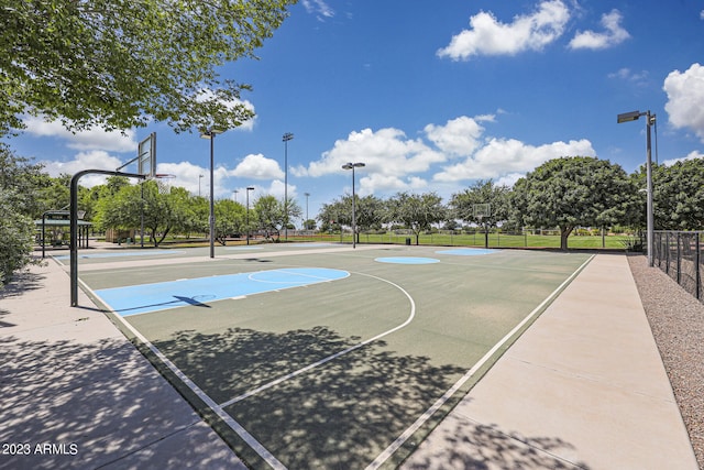 view of basketball court featuring community basketball court and fence