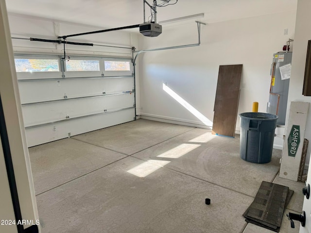 garage with a garage door opener and water heater