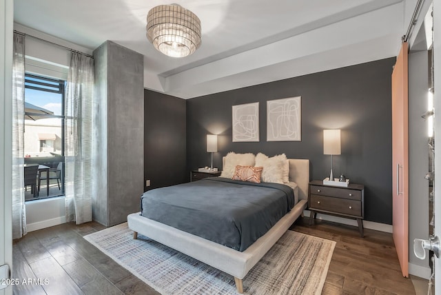 bedroom with dark wood-type flooring