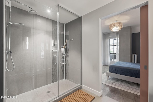 bathroom with a shower with door