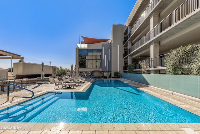 view of pool featuring a patio