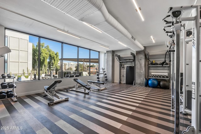 gym with carpet flooring and a wealth of natural light