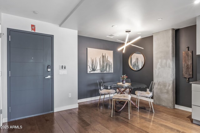 dining room with hardwood / wood-style floors