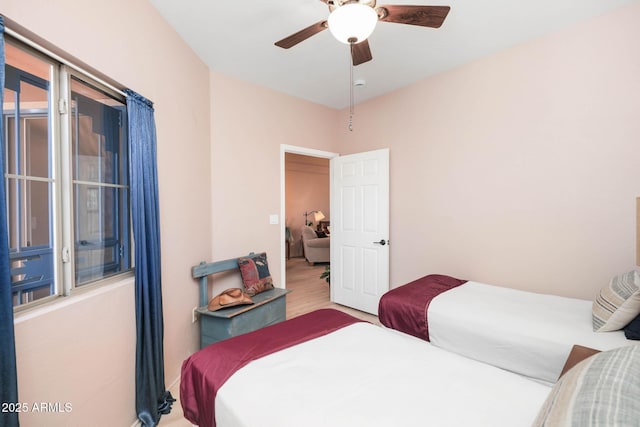 bedroom with ceiling fan and wood finished floors