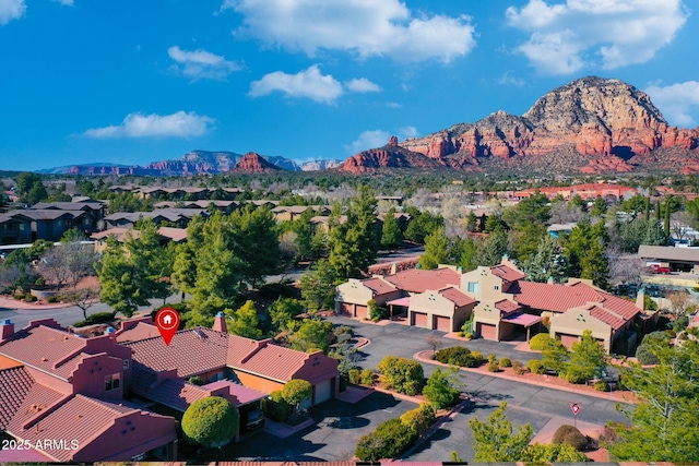 birds eye view of property with a residential view and a mountain view