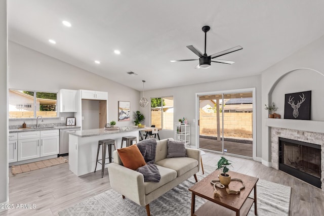 1408 E Carson Rd, Phoenix, AZ 85042 - living room featuring a ceiling fan, recessed lighting, a healthy amount of sunlight, and light wood-type flooring