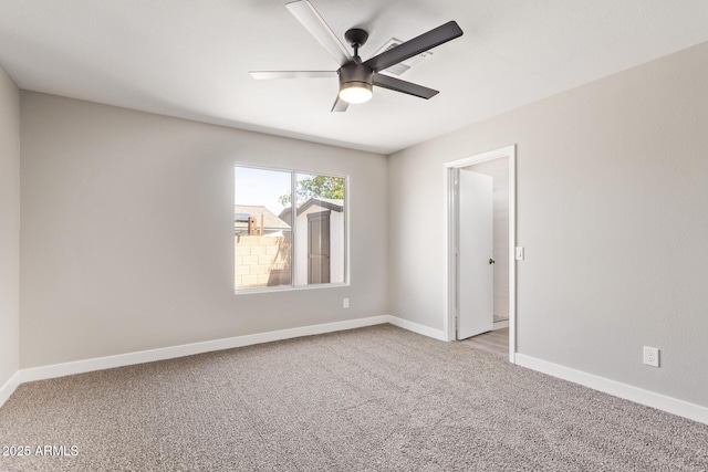 1408 E Carson Rd, Phoenix, AZ 85042 - empty room with baseboards, ceiling fan, and light carpet