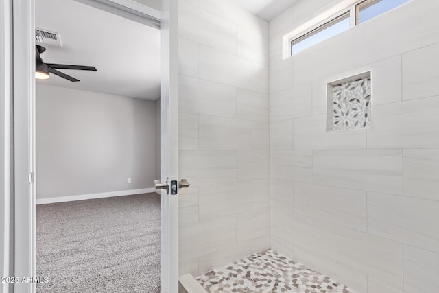 1408 E Carson Rd, Phoenix, AZ 85042 - bathroom with baseboards, a ceiling fan, tiled shower, and visible vents