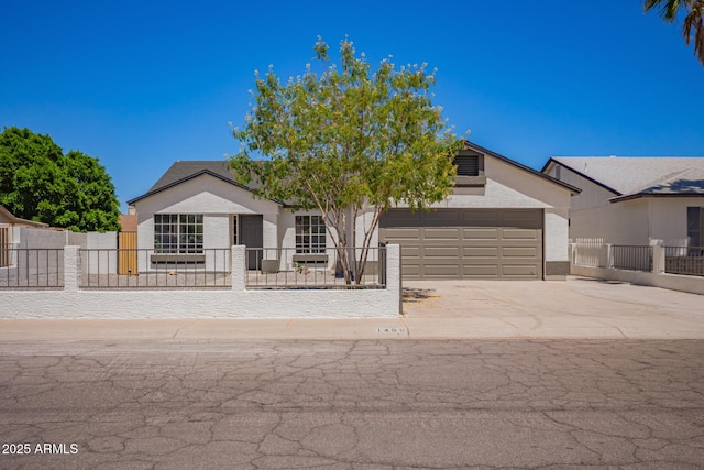 1408 E Carson Rd, Phoenix, AZ 85042 - view of front facade featuring an attached garage, a fenced front yard, and concrete driveway