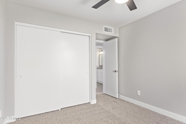 1408 E Carson Rd, Phoenix, AZ 85042 - unfurnished bedroom with visible vents, a closet, baseboards, ceiling fan, and carpet