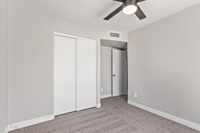 1408 E Carson Rd, Phoenix, AZ 85042 - unfurnished bedroom featuring visible vents, a closet, baseboards, ceiling fan, and carpet