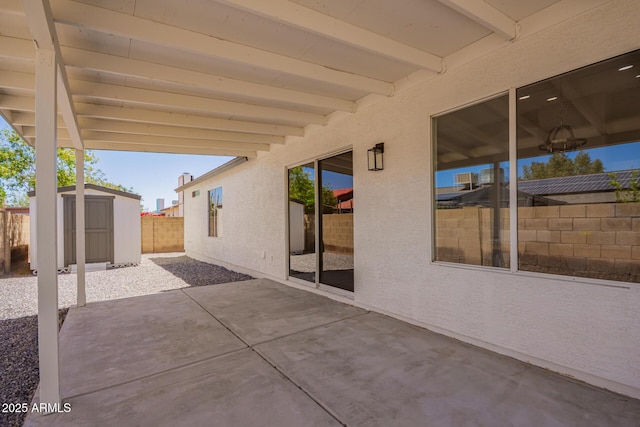 1408 E Carson Rd, Phoenix, AZ 85042 - view of patio with an outdoor structure, a fenced backyard, and a storage shed