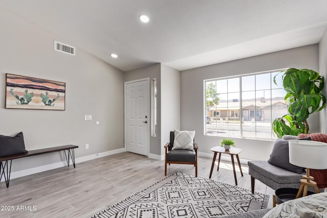 1408 E Carson Rd, Phoenix, AZ 85042 - living area featuring baseboards, recessed lighting, light wood-style flooring, and visible vents