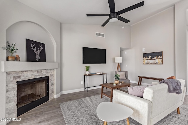 1408 E Carson Rd, Phoenix, AZ 85042 - living area featuring a ceiling fan, baseboards, wood finished floors, lofted ceiling, and visible vents