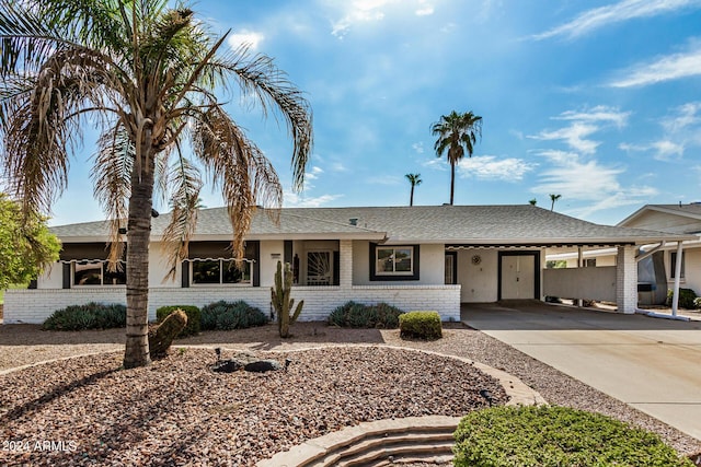 single story home featuring a carport