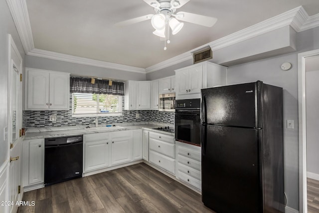 kitchen with sink, crown molding, white cabinetry, black appliances, and dark hardwood / wood-style flooring