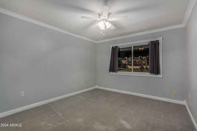 carpeted spare room featuring ornamental molding and ceiling fan