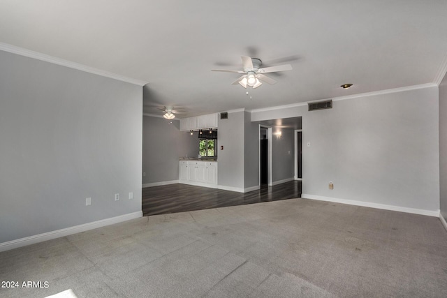 unfurnished room featuring crown molding, carpet flooring, and ceiling fan