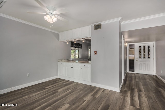 kitchen with ceiling fan, ornamental molding, dark hardwood / wood-style floors, and white cabinets