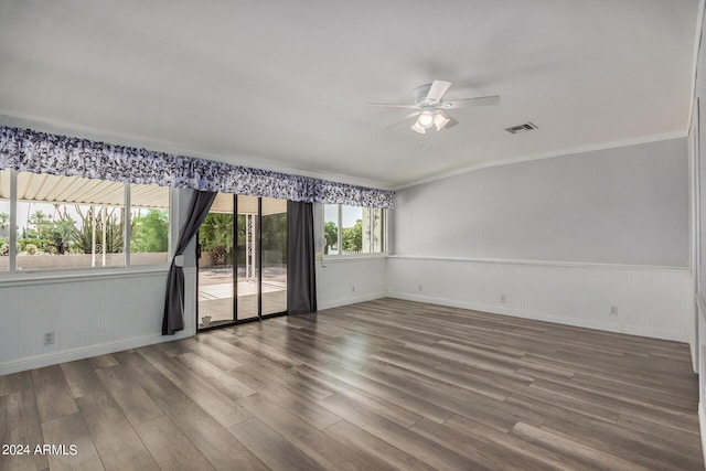 empty room featuring ceiling fan, ornamental molding, and hardwood / wood-style floors