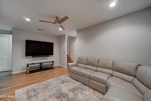 living room featuring ceiling fan and wood-type flooring