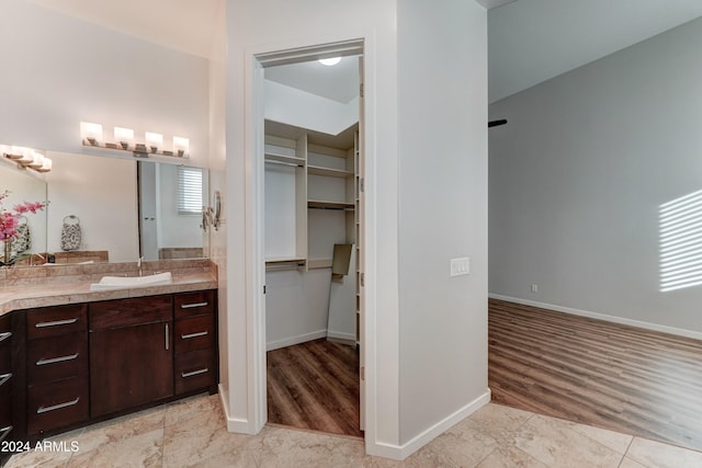 bathroom featuring hardwood / wood-style floors and vanity