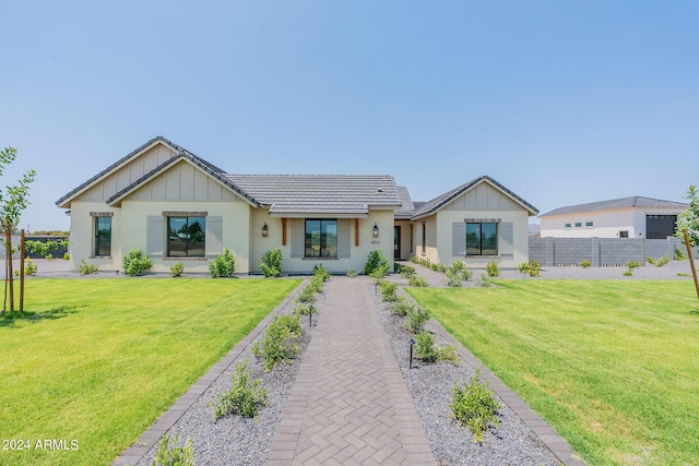 modern inspired farmhouse featuring a front yard