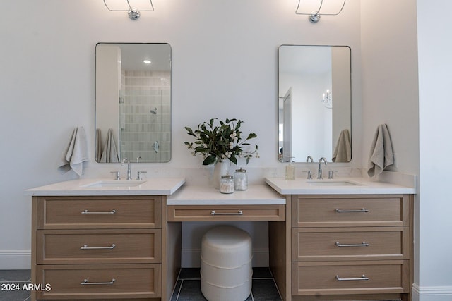 bathroom featuring vanity, tile patterned floors, and a shower with door