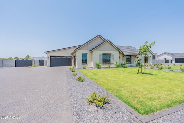 view of front facade with a garage and a front yard