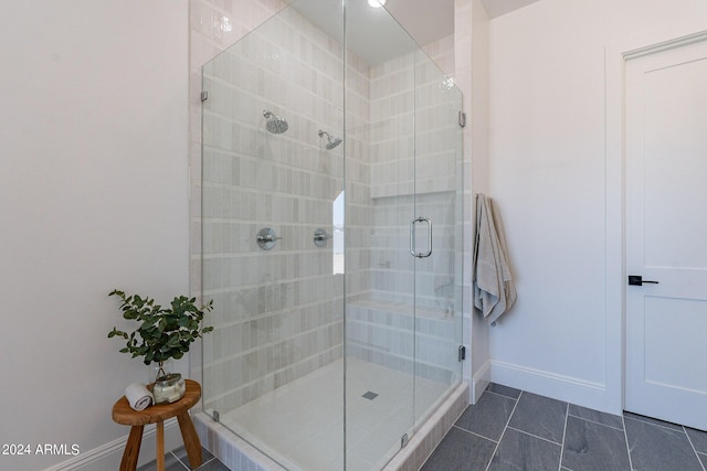 bathroom featuring tile patterned flooring and a shower with door