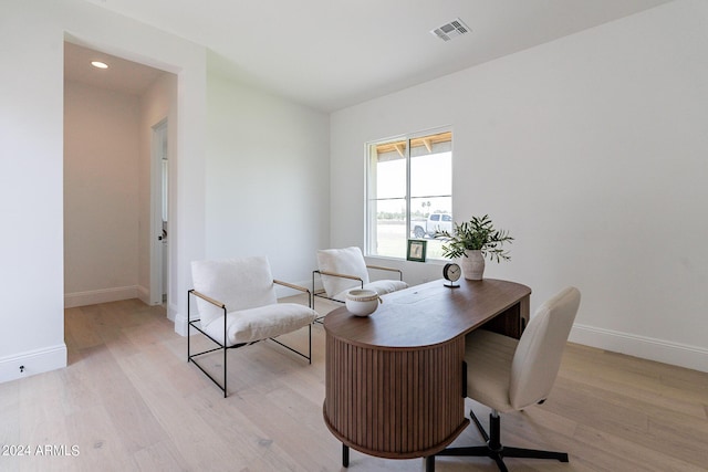 home office with light wood-type flooring