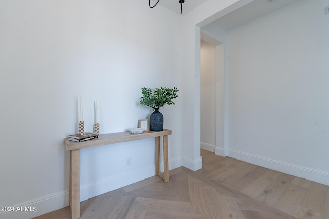 hallway featuring light parquet floors