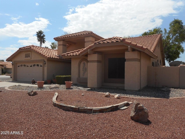 9203 W Behrend Dr, Peoria, AZ 85382 - mediterranean / spanish house with stucco siding, a tiled roof, an attached garage, and concrete driveway