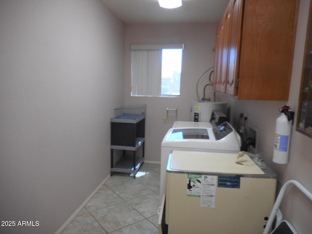 9203 W Behrend Dr, Peoria, AZ 85382 - washroom with cabinet space, separate washer and dryer, electric water heater, light tile patterned flooring, and baseboards