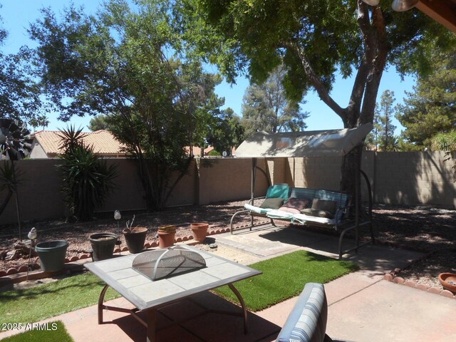9203 W Behrend Dr, Peoria, AZ 85382 - fenced backyard with a patio and an outdoor hangout area