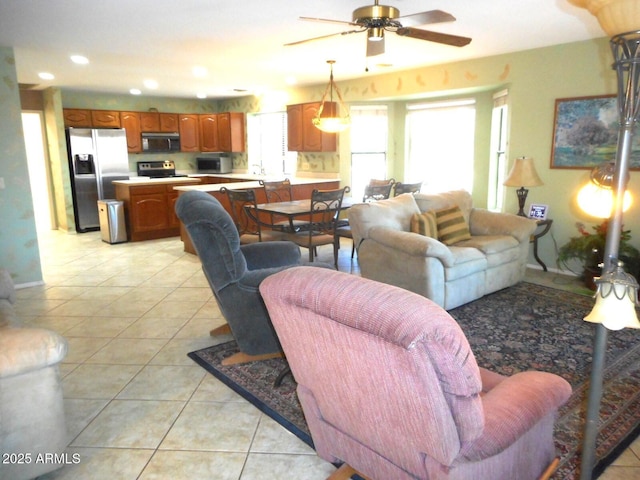 9203 W Behrend Dr, Peoria, AZ 85382 - living room with a ceiling fan, light tile patterned floors, and recessed lighting