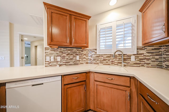 5249 E Shea Blvd Unit 215, Scottsdale, AZ 85254 - kitchen with dishwasher, decorative backsplash, and light countertops