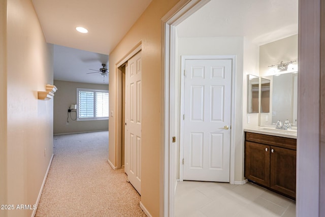 5249 E Shea Blvd Unit 215, Scottsdale, AZ 85254 - hall with a sink and baseboards
