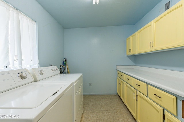 laundry area featuring cabinets and independent washer and dryer