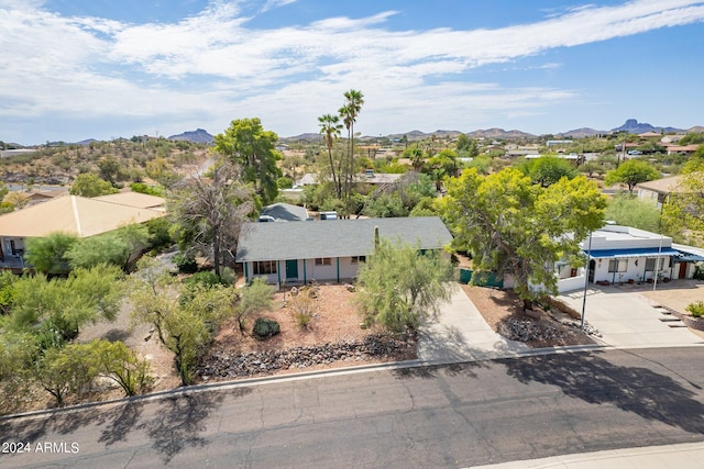 birds eye view of property featuring a mountain view