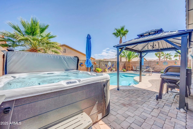 46068 W Guilder Ave, Maricopa, AZ 85139 - fenced backyard with a gazebo, a hot tub, and a patio area