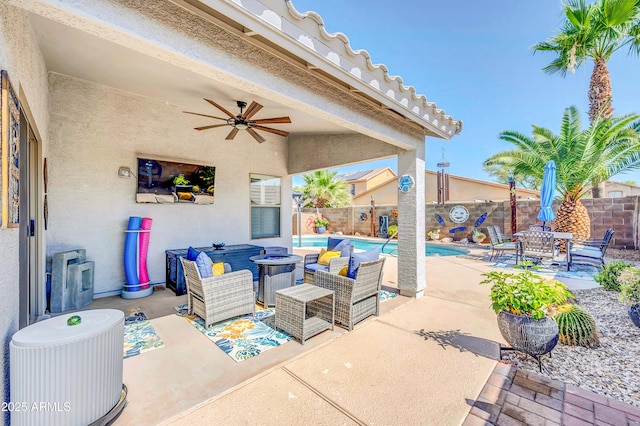 46068 W Guilder Ave, Maricopa, AZ 85139 - fenced backyard featuring ceiling fan, a patio area, an outdoor fire pit, and outdoor dining area
