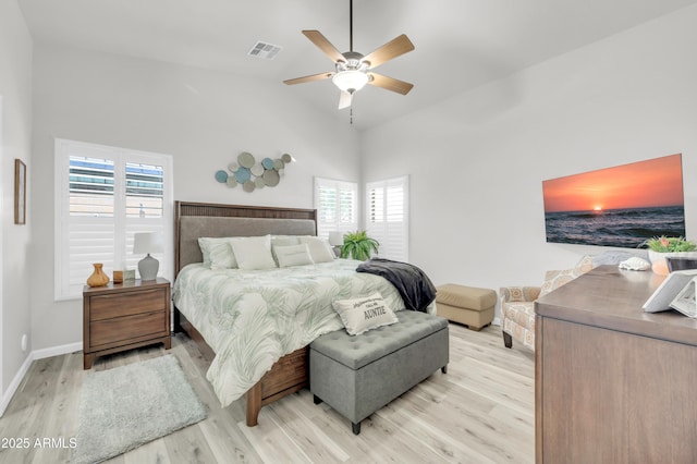 46068 W Guilder Ave, Maricopa, AZ 85139 - bedroom featuring light wood-style floors, vaulted ceiling, and ceiling fan