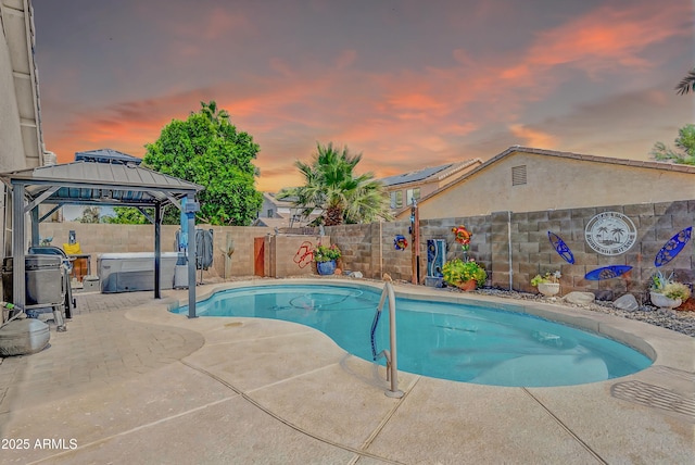 46068 W Guilder Ave, Maricopa, AZ 85139 - view of swimming pool featuring a fenced backyard, a hot tub, a patio area, and a gazebo