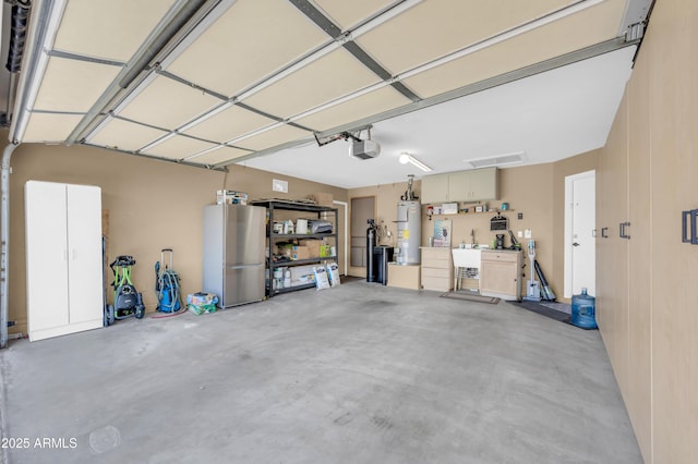 46068 W Guilder Ave, Maricopa, AZ 85139 - garage featuring water heater and a garage door opener