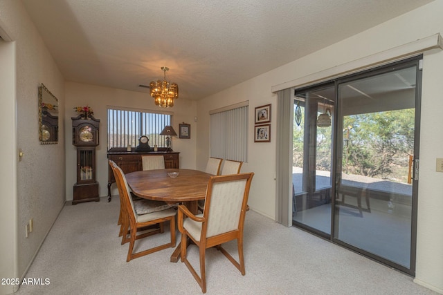 1147 Pedro Ct, Rio Rico, AZ 85648 - dining room with light carpet, a chandelier, and healthy amount of natural light
